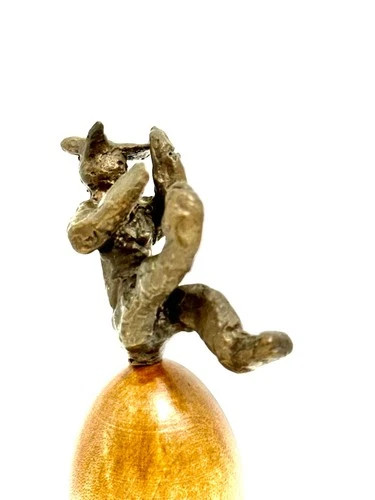 A Dusseldort Radschlager cartwheeler boy souvenir Bronze on a plinth wood or tea