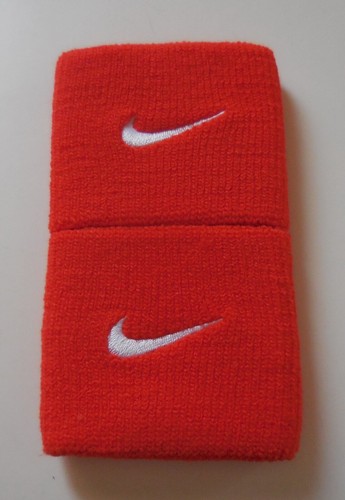 Nike Dri-Fit Tennisarmbänder Team orange/weiß 1 Paar