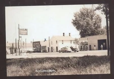 REAL PHOTO SIX LAKES MICHIGAN DOWNTOWN GAS STATION OLD CARS POSTCARD COPY