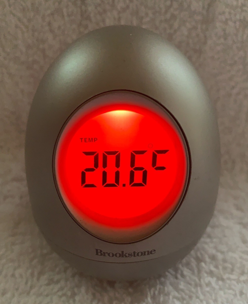 Brookstone “Bob” Silver Oval Egg Wobble Clock 5-in-1 Time