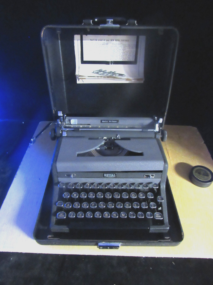 A 1954 Royal Quiet De Luxe — the typewriter Hemingway and Kerouac era writers swore by — complete with its original case and key, practically begging to live on a writer's desk.