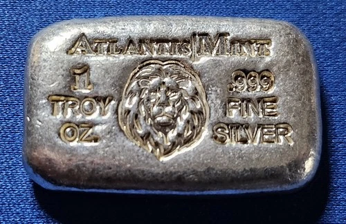 A Atlantis Mint LION- 1 oz .999 Fine Silver Hand Poured Bar