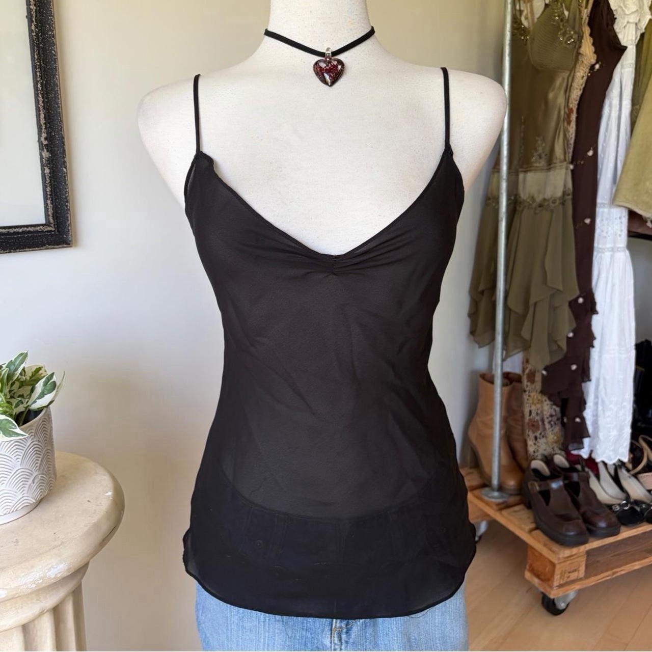 Black silk camisole tank top, laid flat