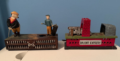 2 - Cast Iron Mechanical Piggy Banks ''GOLFER AND CADDIE'' and ''ORIENT EXPRESS''