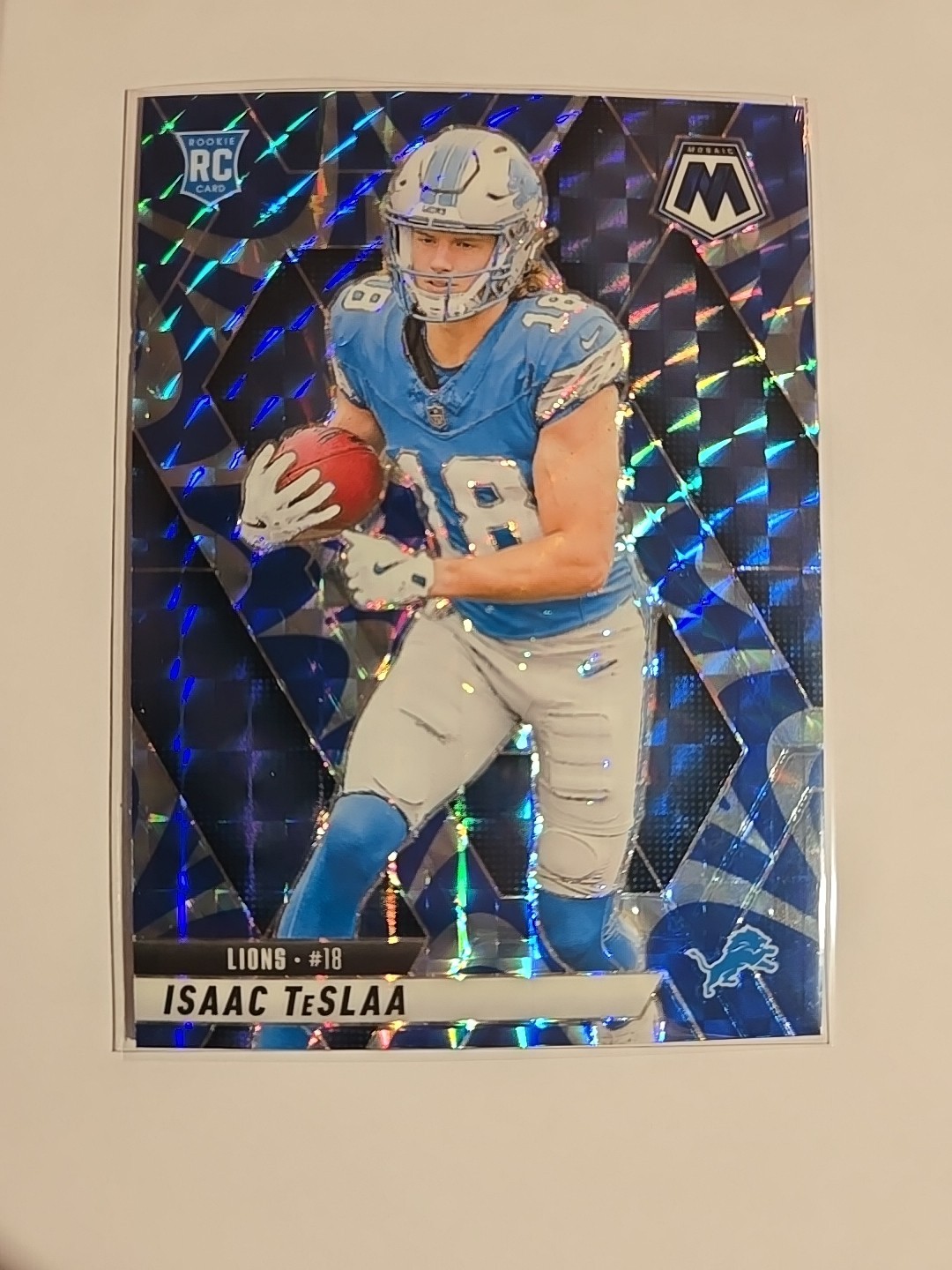 2025 Panini Mosaic ISAAC TeSLAA #319 Reactive Blue Prizm RC Detroit Lions