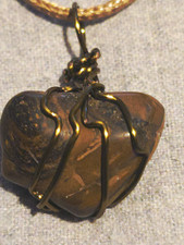 Tiger Iron Pendant On A Tan Hemp Necklace