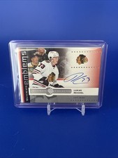 2024-25 Ultimate Collection Emblems Lukas Reichel Auto Chicago Blackhawks #UE-LR