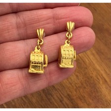 Máquina tragamonedas aretes colgantes tono dorado poste de juego de casino