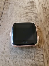 periwinkle and rose gold fitbit versa