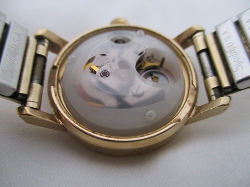Reloj de pulsera eléctrico analógico Timex con banda de expansión tono dorado indicador de fecha - Imagen 11 de 12