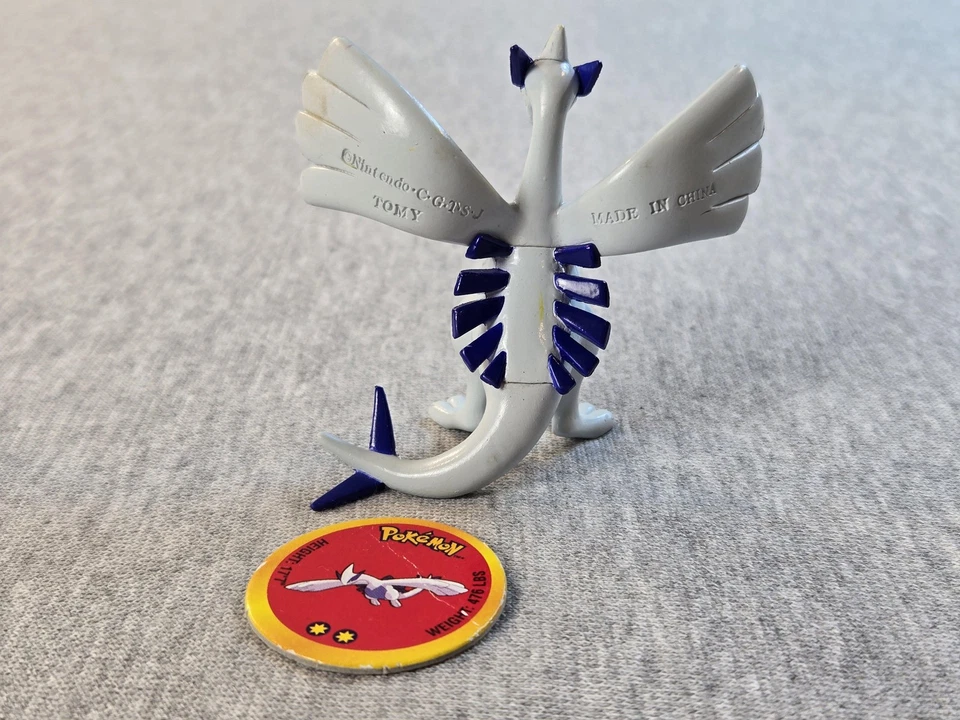 Figura de acción Pokemon Lugia 2000 vintage TOMY Nintendo juguete con moneda Pog coleccionar Foto 2 de 4