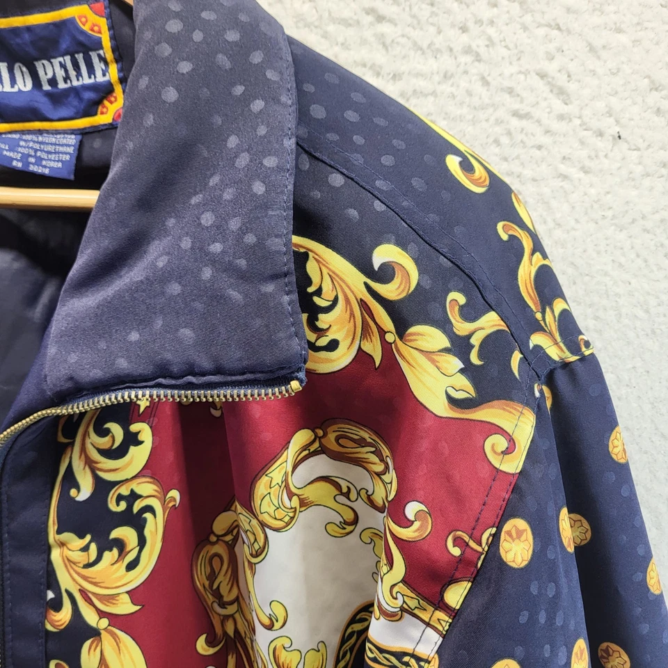 Chaqueta cortavientos Otello Pelle para mujer azul medio cadenas AOP dorada de gran tamaño Foto 3 de 4