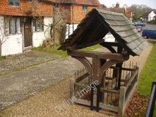 Photo 12x8 Alfold Stocks Alfold Bars Two seater stocks under a wooden cano c2011