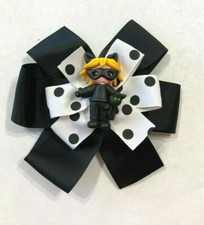 Beautiful Bat Girl with green eyed Cat inspired hair bow for girls.