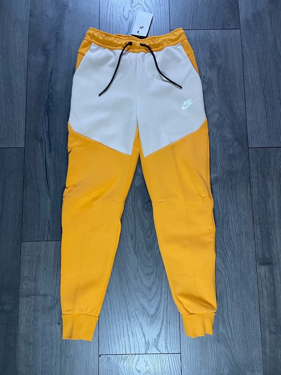 Nike nsw pants yellow hotsell