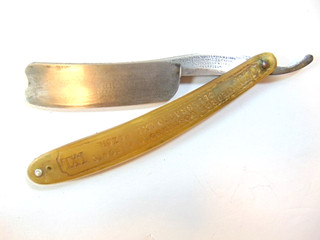old Geo. Wostenholm & Son's barbers' straight razor; labeled in blade & handle