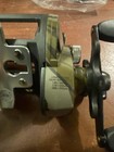 Shakespeare camo bait Caster fishing reel RH New — photo 6