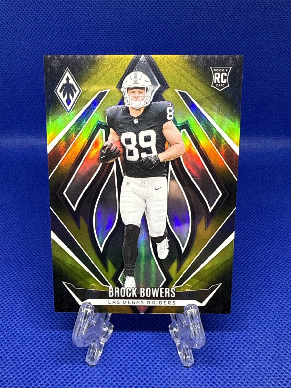 2024 Panini Phoenix - Rookies Brock Bowers #165 Gold Fade /125 (RC)