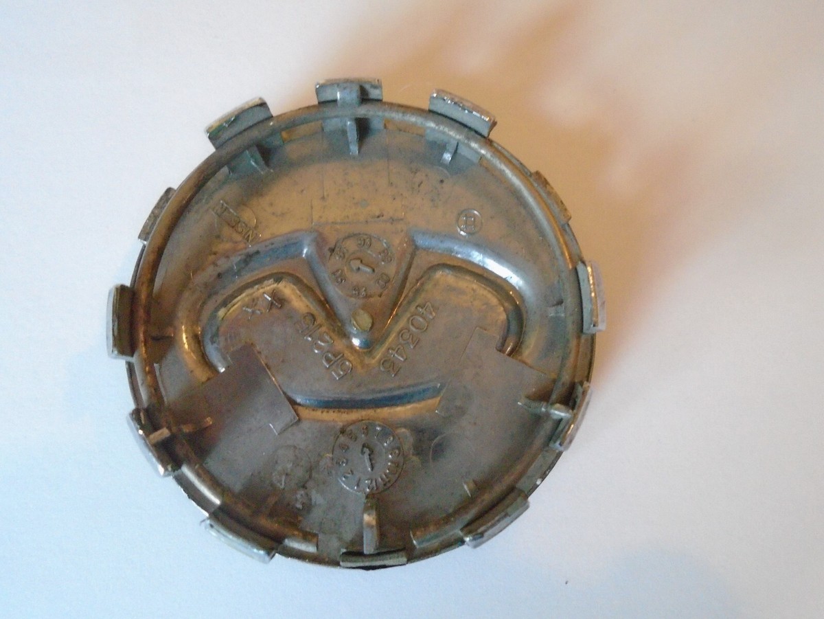 NISSAN 40343 5P215 OEM Center Wheel Hub Cap gold in color