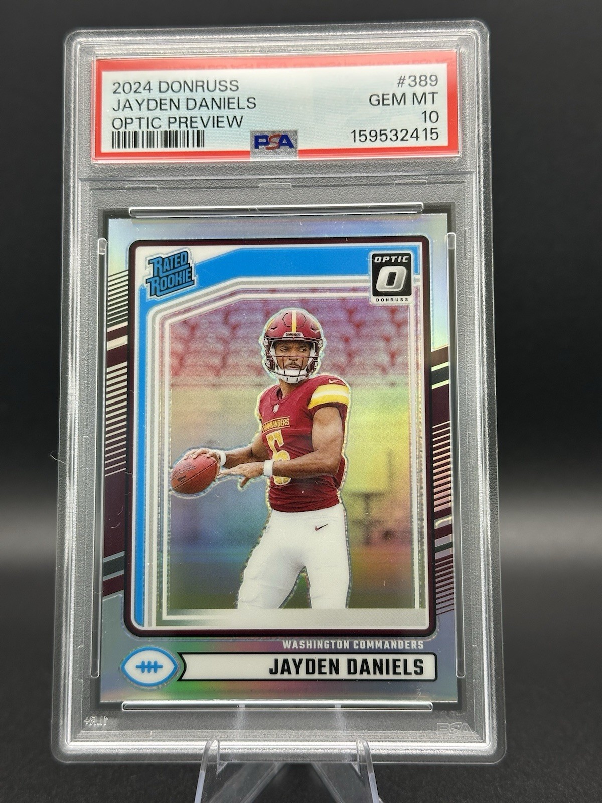 2024 Panini Donruss - Rated Rookie Jayden Daniels #389 Optic Preview Holo PSA 10 view 1
