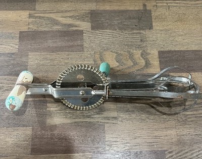 Vintage Ekco A&J ''High Speed'' hand-crank egg beater with green handles.