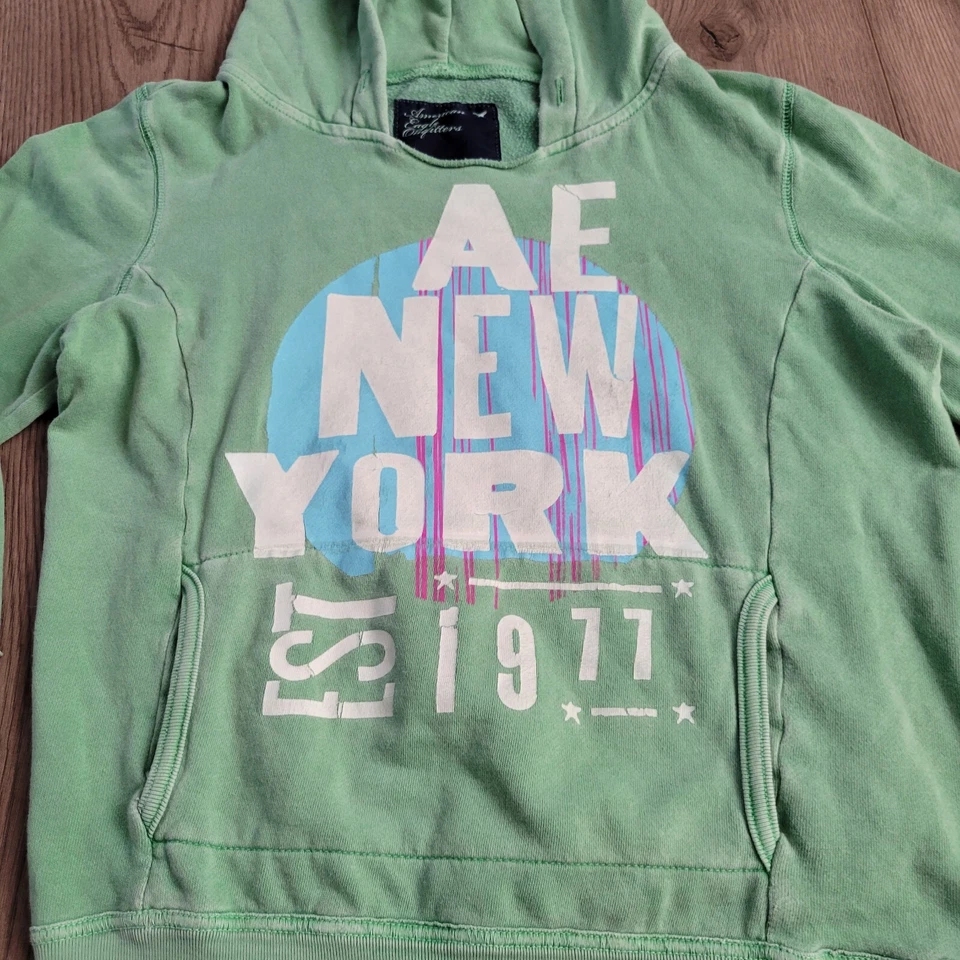 Sudadera American Eagle Mujer Mediana Verde Sudadera con Capucha Nueva York Destino Polar Foto 3 de 4