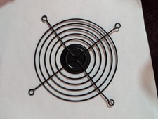 black wire fan grill, also known as a fan guard or finger guard