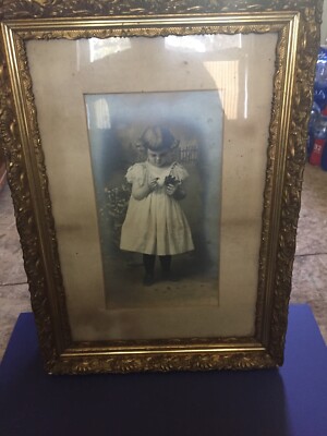 framing antique baby clothes