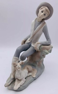 lladro boy sitting with dog