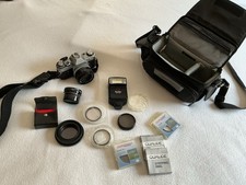 Canon AE-1 SLR Film Camera, Strap, And Case, Lenses, Filters And Rings
