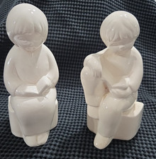 Vintage White Porcelain Bookends of Boy and Girl Reading Books