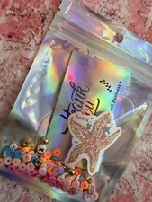 bracelet making kit beads, clay beads, plastic beads, new condition, all colors.