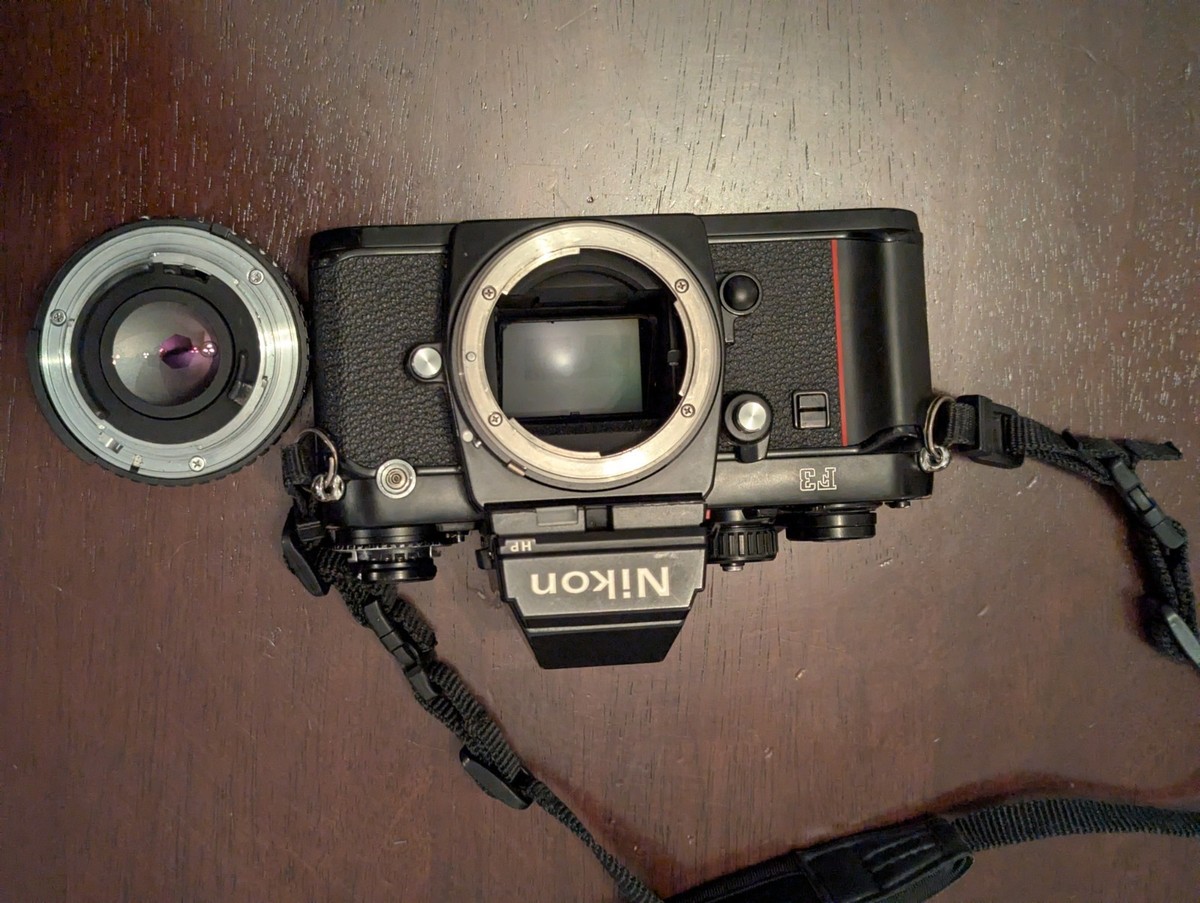 Nikon F3 HP Camera with Strap Hood and 50mm F1.8 Ai-s Lens Black