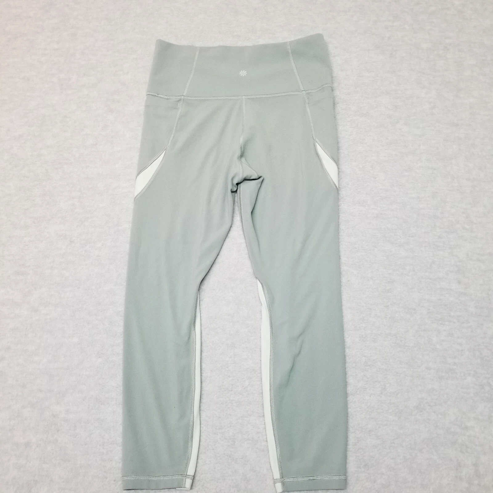 athleta salutation stash pocket 7/8 tight leggings