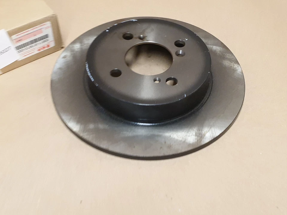 Par de discos de freno trasero Suzuki Swift Mk4 259 mm 2010-en 55611-61M10-000 genuino NUEVO Foto 2 de 4