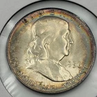 1956 P Franklin Half Dollar with peripheral toning and light rainbow qualities