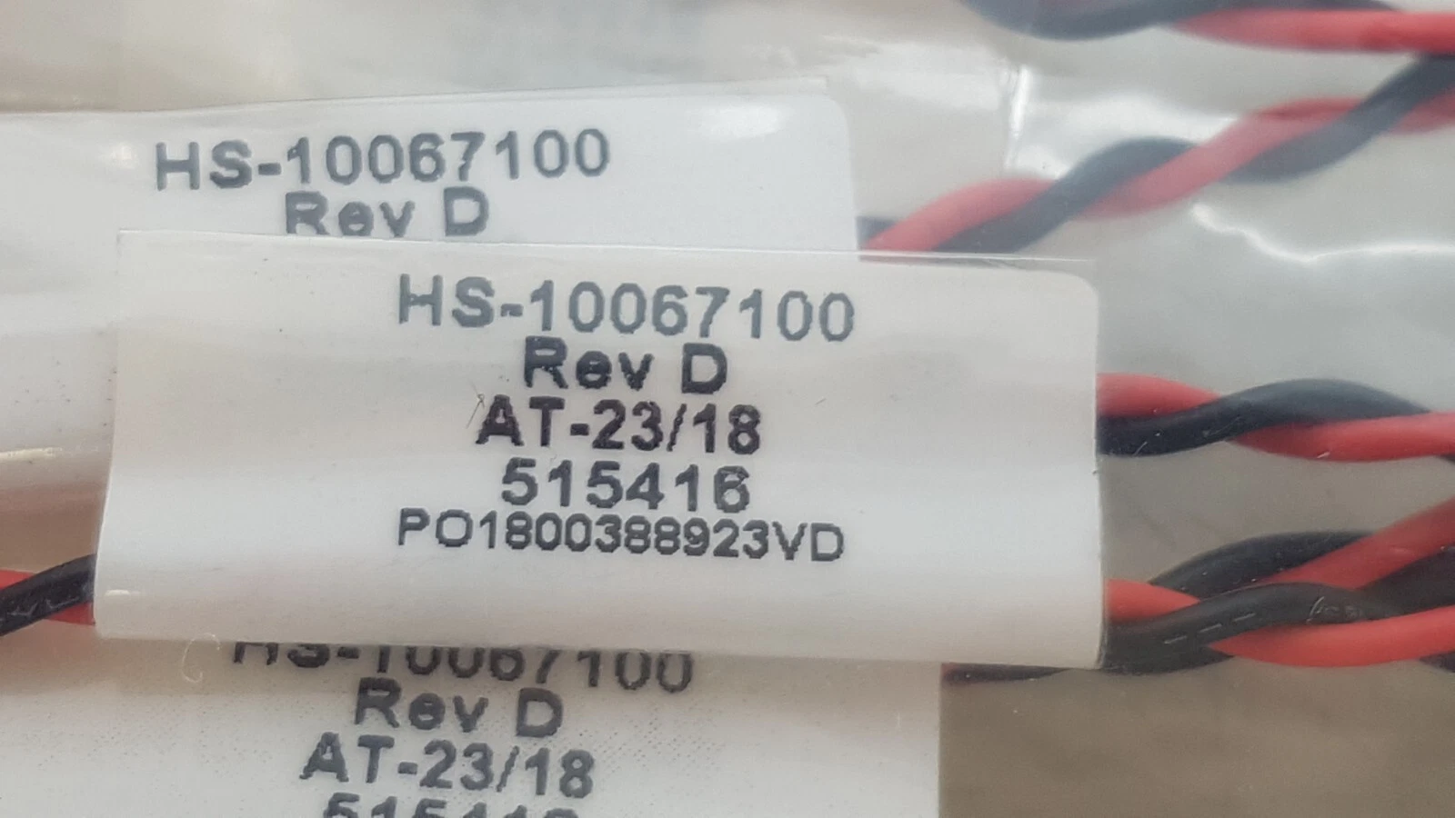 Harness tag: HS-10067100 Rev D, AT-23/18, 515416