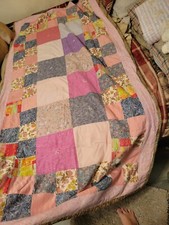 Multi colored quilted baby blanket