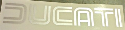 1975-85 DUCATI (open letters) silver gas petrol tank die cut vinyl stickers each