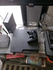 playstation 3 and Games (factory reset comes with cords and controller)
