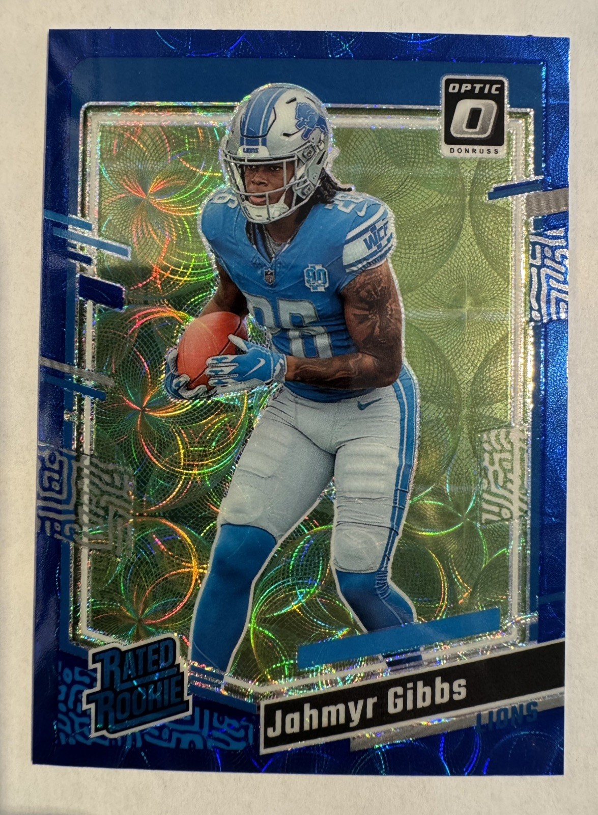 2023 Jahmyr Gibbs Panini Donruss Optic Blue Scope Prizm Rated Rookie #236