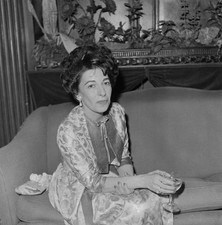 American composer producer Sylvia Fine pictured seated on a sofa a- Old Photo