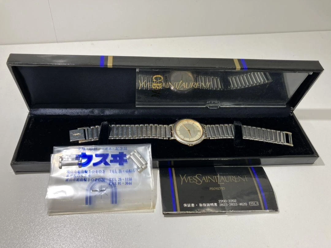 SAINT LAURENT (YSL) Orologio al quarzo Yves Saint Laurent acciaio argento con scatola e manuale (batteria scarica)