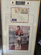 Ali hand written envelope & color signed photo.