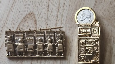 vintage gold-tone casino slot machine brooch featuring a genuine US Jefferson...