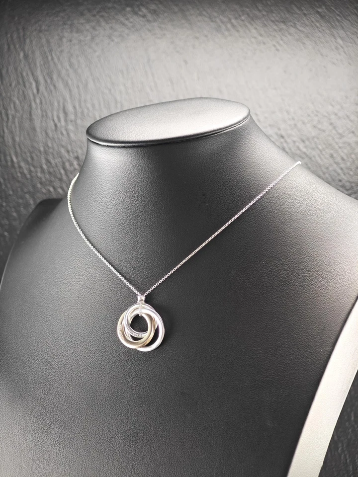 Ожерелье из чистого серебра с переплетающимися кругами золотистого цвета Tiffany & Co. - Изображение 4 из 4