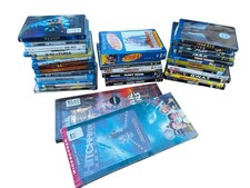 Lot of DVDs and Blu Rays All Sealed Except Pile on Right