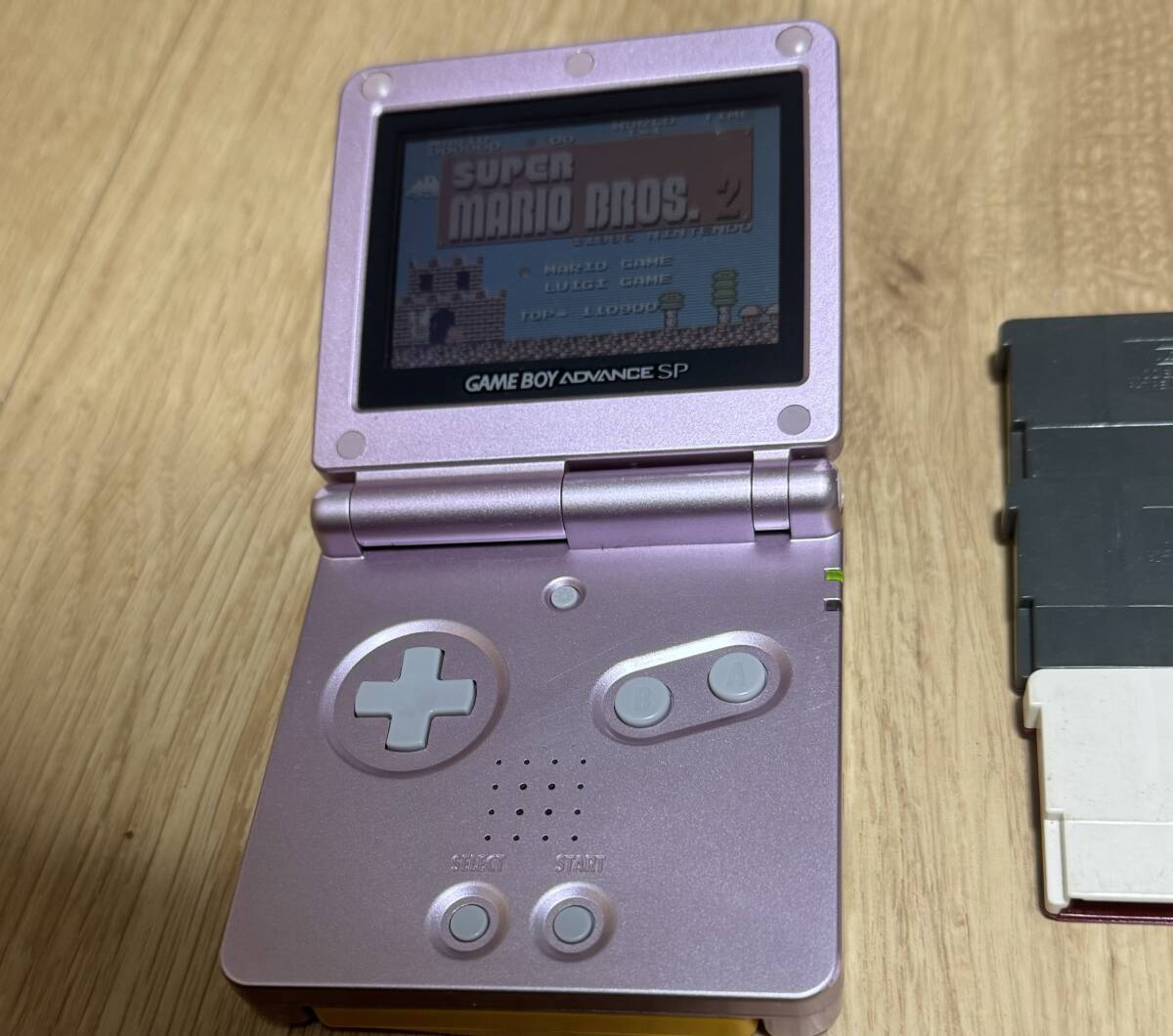 Nintendo Game Boy Advance SP Pearl Pink with 7 Mario Games Nintendo Game Boy Advance SP Pearl Pink with 7 Mario Games