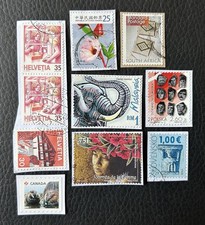Lot de 10 timbres de Pays divers et années diverses - encore sur frag Stamps D44