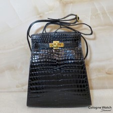 Hermès Kelly Sport 20 mit Gelbgold Beschlägen Aligator Schwarz
